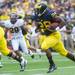 Michigan running back Fitzgerald Toussaint runs the ball during the first quarter of their game against Central Michigan, Saturday, Aug, 31.
Courtney Sacco I AnnArbor.com  